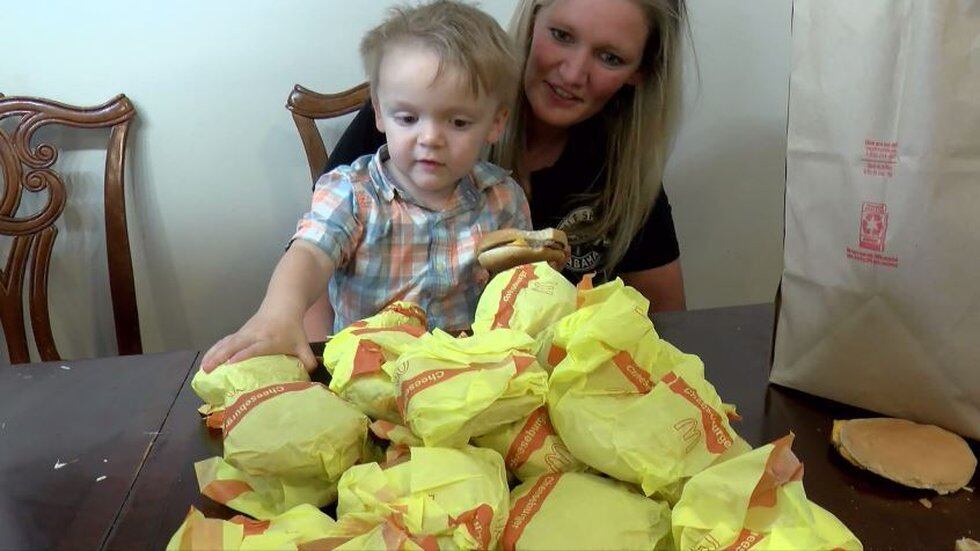 The toddler only ate about half of one burger, so his mother says she gave away some of the...