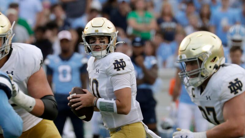 Notre Dame quarterback Drew Pyne (10) looks to pass during the second half of an NCAA college...