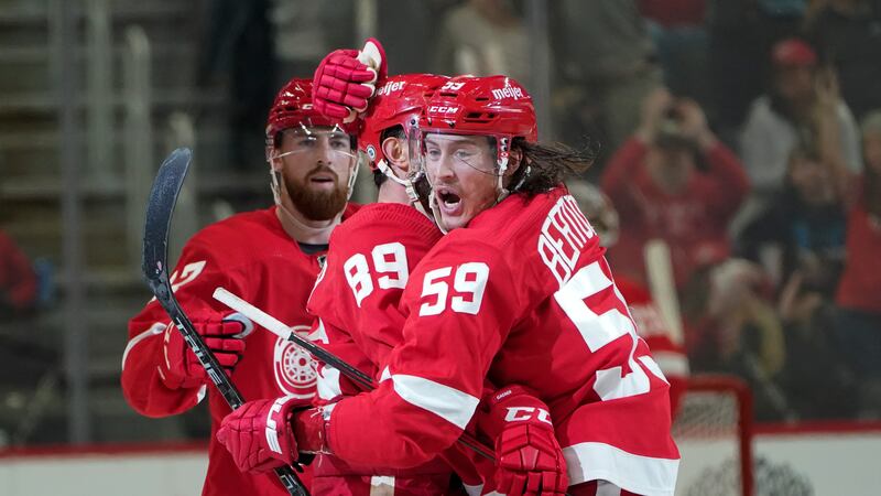 Detroit Red Wings center Sam Gagner (89) celebrates his empty net goal with Tyler Bertuzzi...