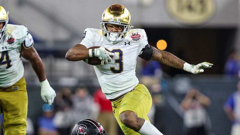 Notre Dame running back Logan Diggs (3) runs the ball during the second half of the Gator Bowl...