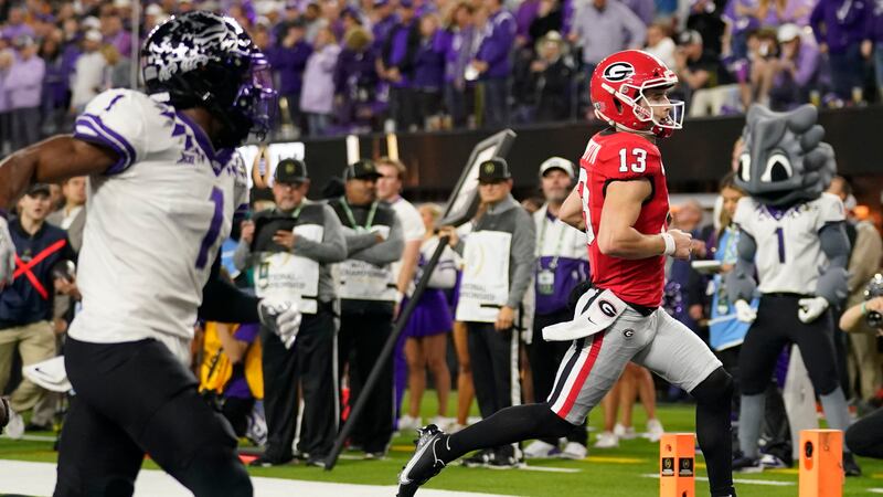 Georgia quarterback Stetson Bennett (13) runs into the end zone for a touchdown against TCU...