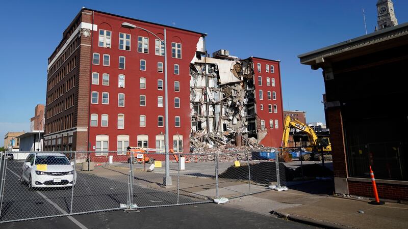 FILE - An apartment building that partially collapsed two days earlier is seen, May 30, 2023,...