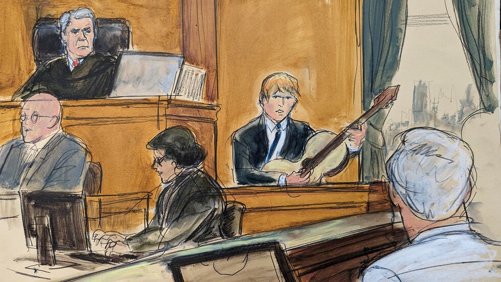 Ed Sheeran plays his guitar on the witness stand during his testimony with Judge Louis Stanton...