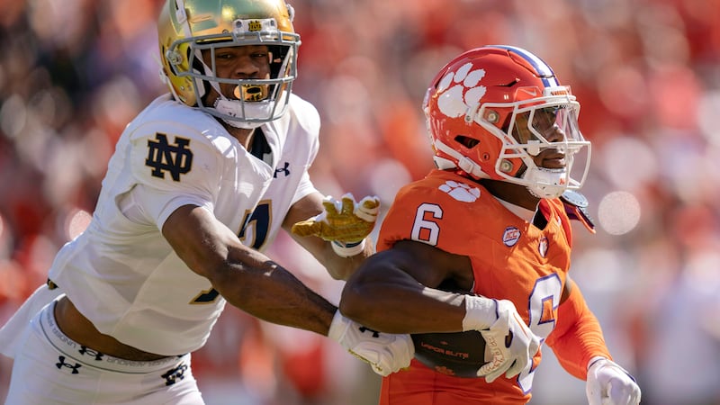 Clemson wide receiver Tyler Brown (6) scores a touchdown while pursued by Notre Dame...