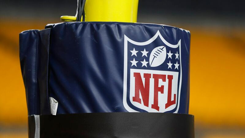 FILE - In this Dec. 15, 2019, file photo, The NFL logo NFL is on the goal post at Heinz Field...